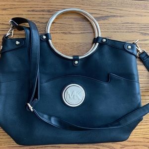 MK Crossbody tote. Vintage original gold hoops and MK medallion on the front.